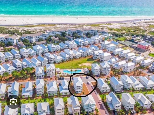 a view of a swimming pool with an outdoor space and seating area