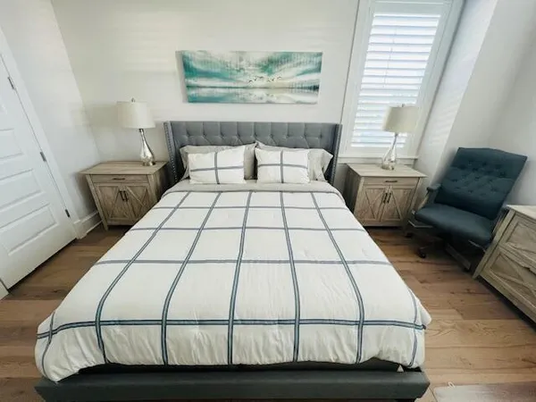 a bedroom with a bed and window