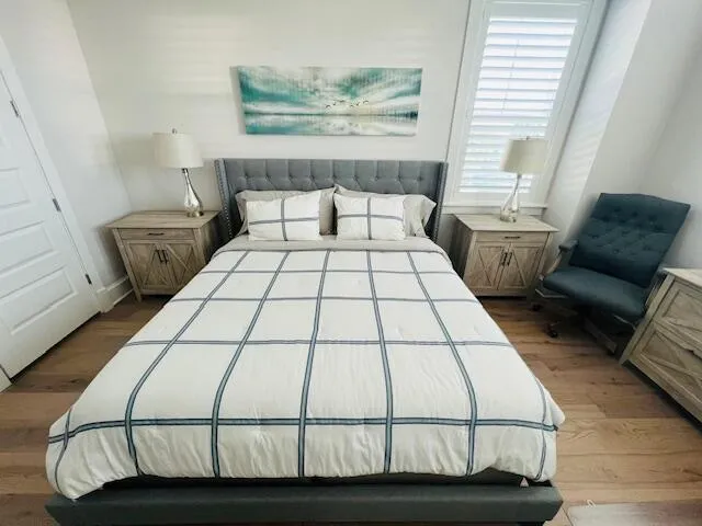 a bedroom with a bed and window