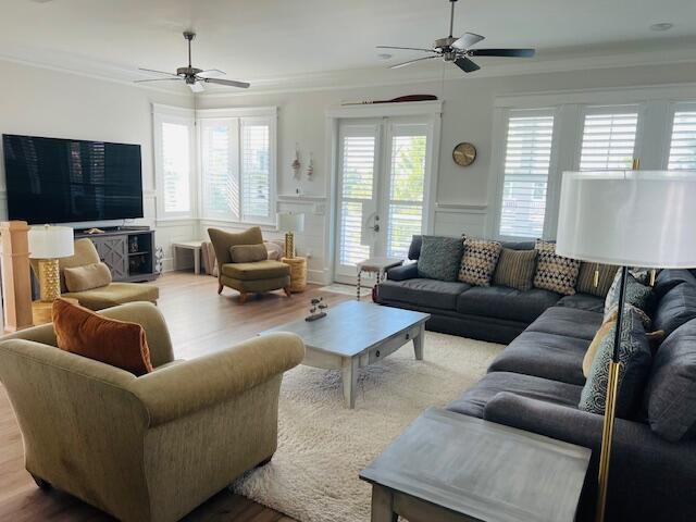 11 East Crabbing Hole Ln Inlet Beach Inlet Beach, FL 32461 - Photo 9 of 34 a living room with furniture and a flat screen tv