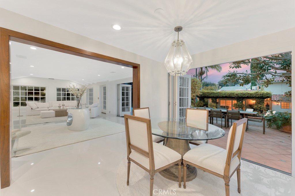 726 Foothill Road Beverly Hills, CA 90210 - Photo 14 of 59 a dining room with furniture and window
