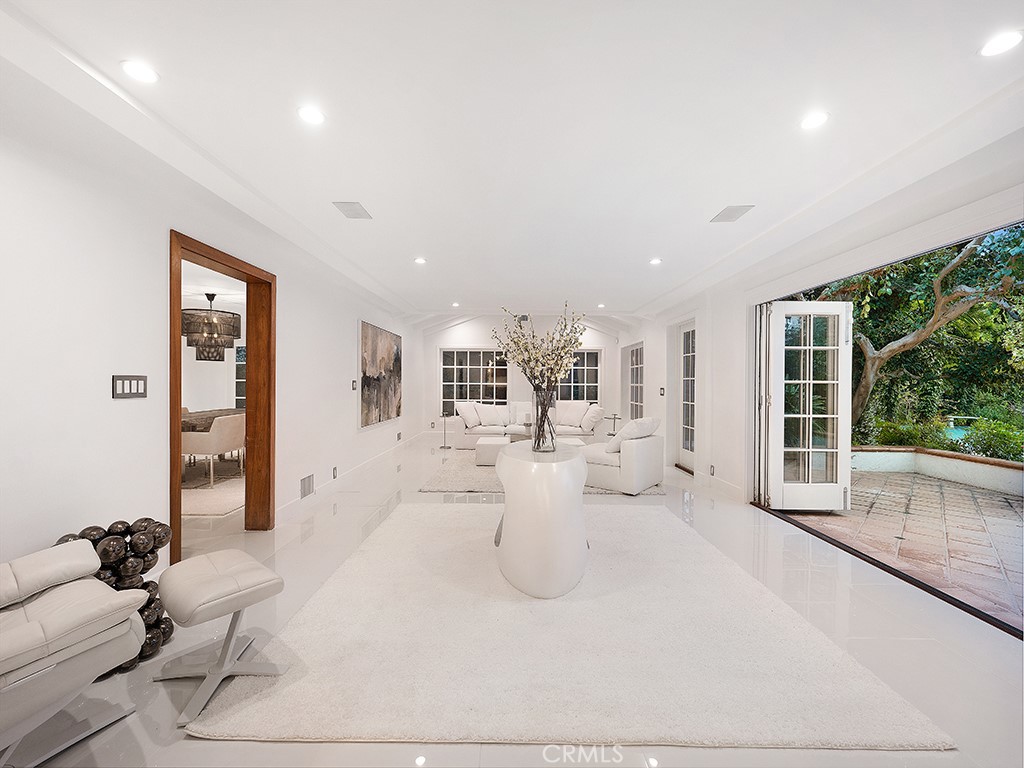 726 Foothill Road Beverly Hills, CA 90210 - Photo 15 of 59 a view of a living room and chandelier