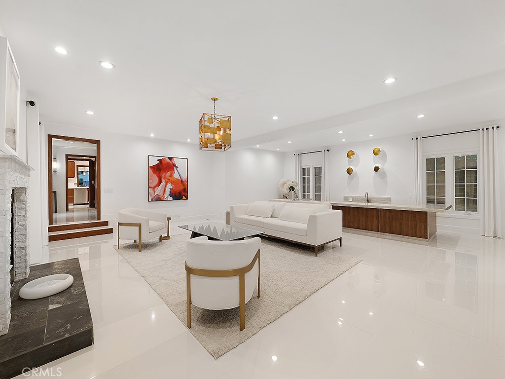 726 Foothill Road Beverly Hills, CA 90210 - Photo 18 of 59 a living room with furniture and a wooden floor