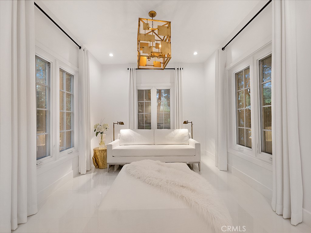 726 Foothill Road Beverly Hills, CA 90210 - Photo 20 of 59 a spacious bedroom with a bed and a large window