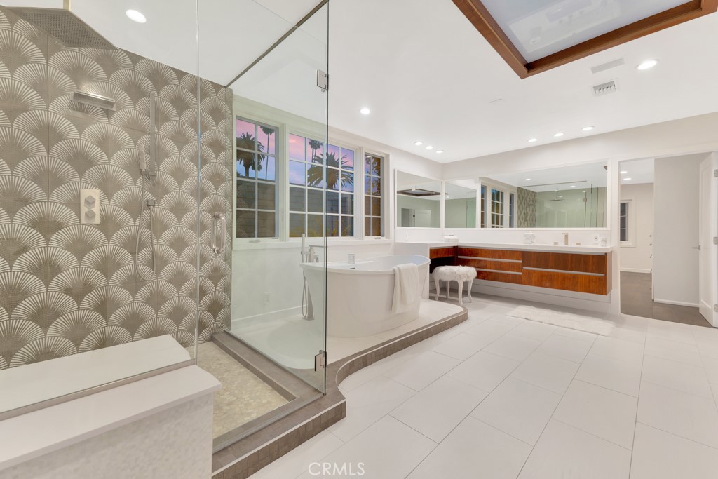 726 Foothill Road Beverly Hills, CA 90210 - Photo 26 of 59 a living room with a couch and a table