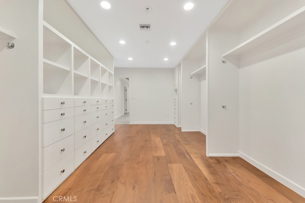 726 Foothill Road Beverly Hills, CA 90210 - Photo 31 of 59 a view of an empty room with wooden floor