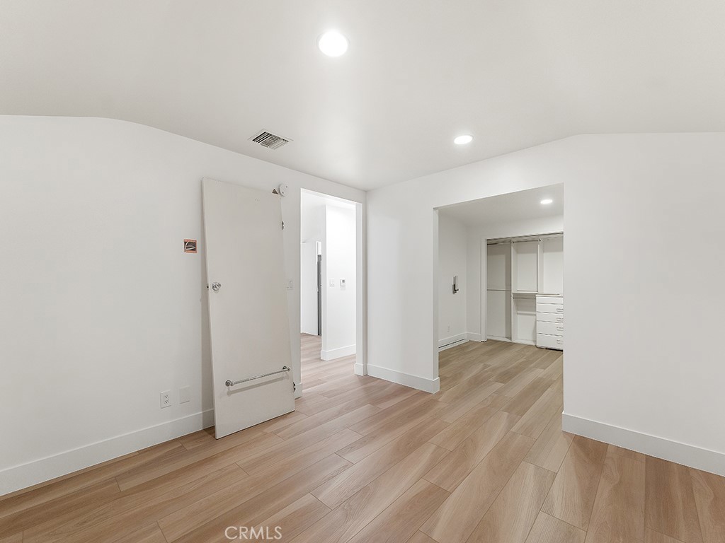 726 Foothill Road Beverly Hills, CA 90210 - Photo 36 of 59 a view of a livingroom with wooden floor and closet
