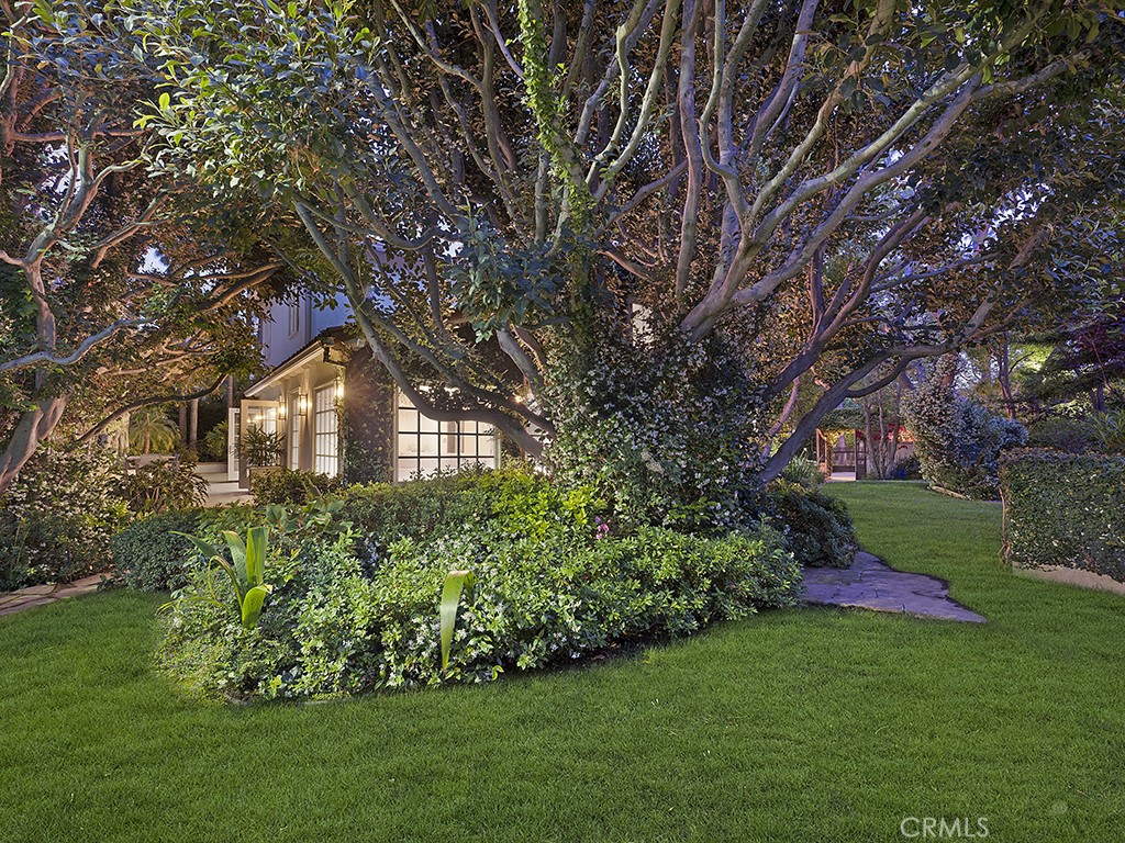 726 Foothill Road Beverly Hills, CA 90210 - Photo 37 of 59 a front view of a house with a yard