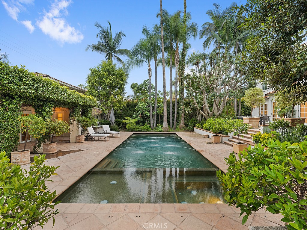 726 Foothill Road Beverly Hills, CA 90210 - Photo 38 of 59 a view of a swimming pool with a patio