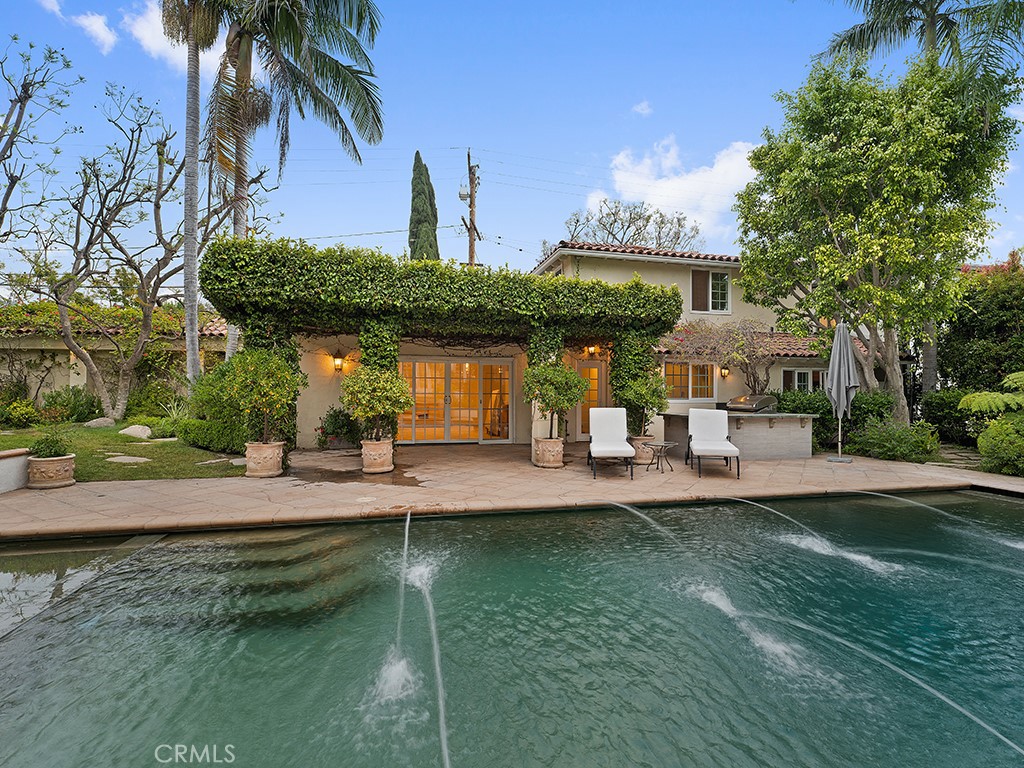 726 Foothill Road Beverly Hills, CA 90210 - Photo 39 of 59 a front view of a house with garden