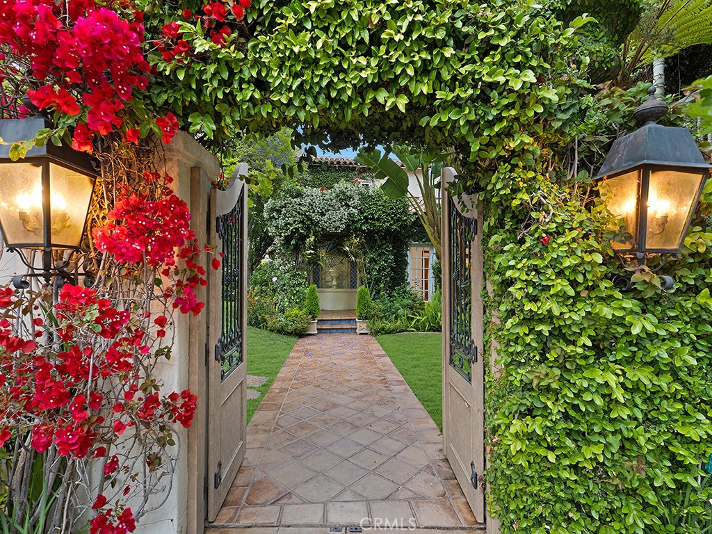 726 Foothill Road Beverly Hills, CA 90210 - Photo 42 of 59 a view of a pathway covered with flower plants
