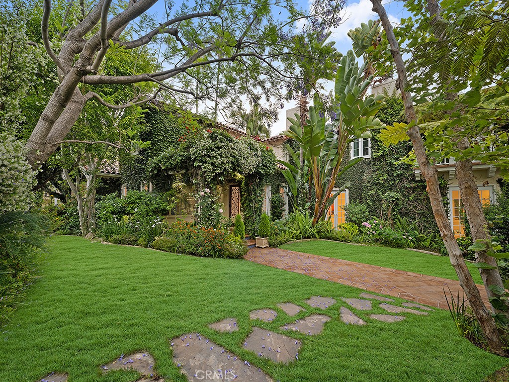 726 Foothill Road Beverly Hills, CA 90210 - Photo 45 of 59 a view of a backyard with large trees