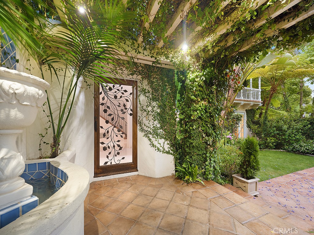 726 Foothill Road Beverly Hills, CA 90210 - Photo 49 of 59 a view of entryway with paintings on the wall