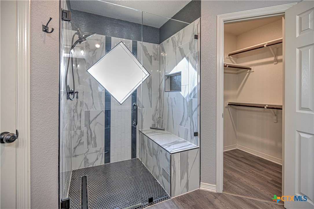 3106 Pitchfork Circle Belton, TX 76513 - Photo 21 of 45 a bathroom with a sink a mirror and shower