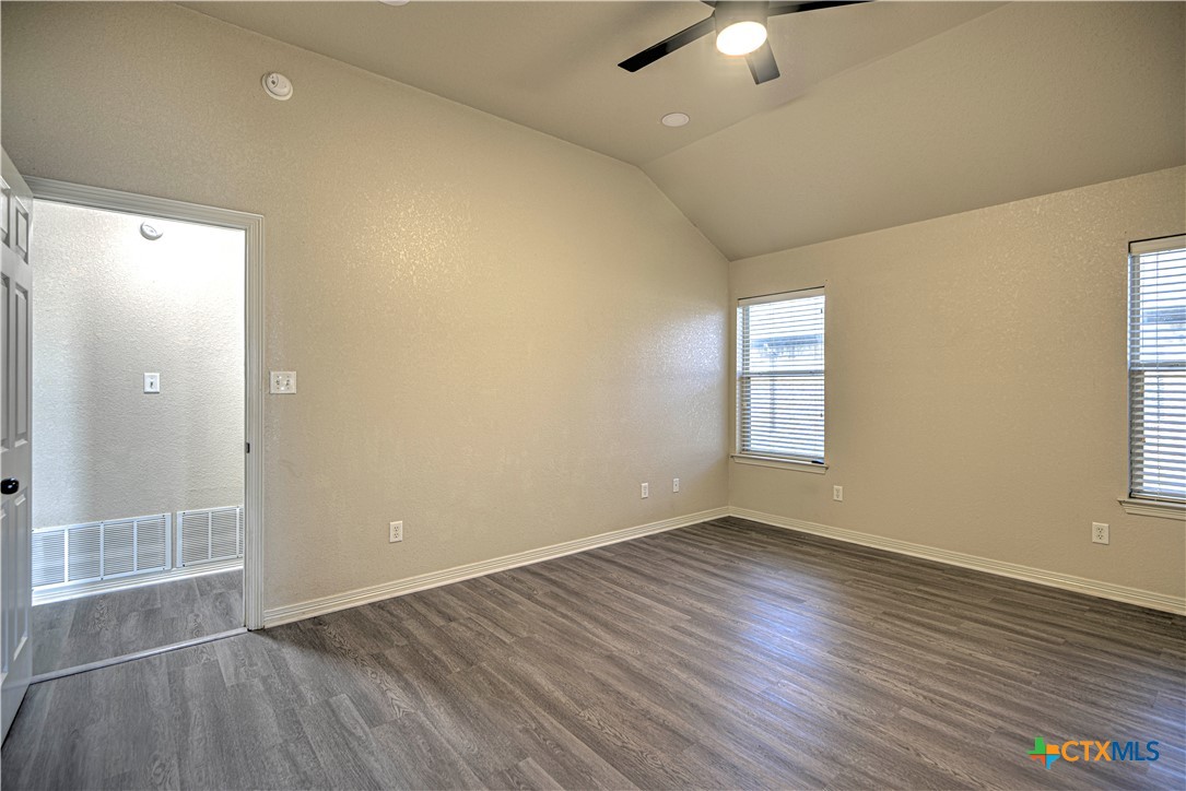 3106 Pitchfork Circle Belton, TX 76513 - Photo 22 of 45 wooden floor in an empty room with a window