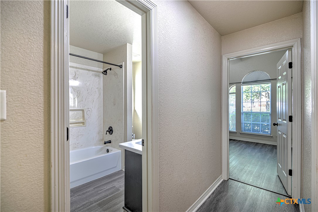 3106 Pitchfork Circle Belton, TX 76513 - Photo 23 of 45 a bathroom with a bathtub and a shower