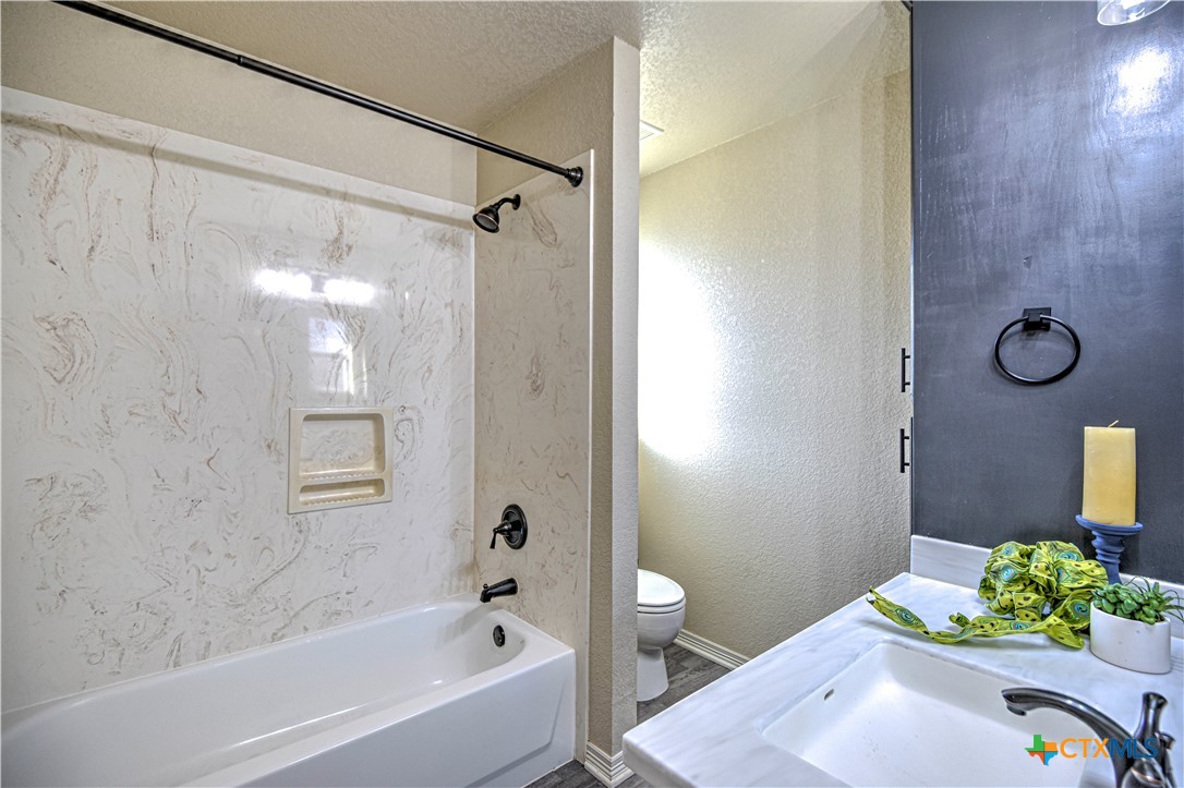 3106 Pitchfork Circle Belton, TX 76513 - Photo 26 of 45 a bathroom with a sink and a bathtub