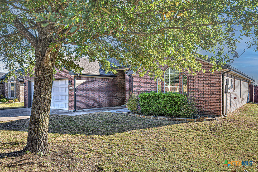 3106 Pitchfork Circle Belton, TX 76513 - Photo 45 of 45 a view of a brick house next to a yard with large trees