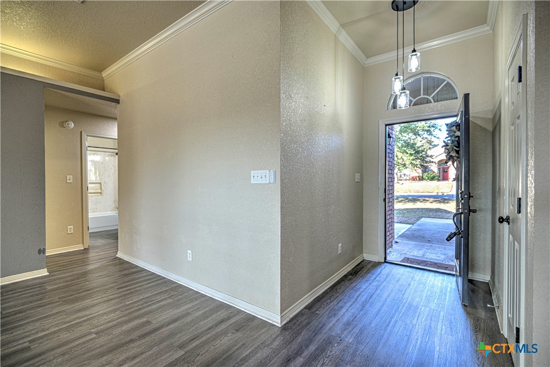 3106 Pitchfork Circle Belton, TX 76513 - Photo 5 of 45 a view of a hallway with wooden floor and stairs