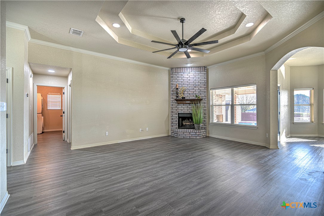 3106 Pitchfork Circle Belton, TX 76513 - Photo 8 of 45 a view of an empty room with wooden floor and a window