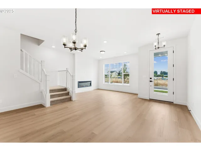 a view interior of a house with wooden floor and a ceiling fan