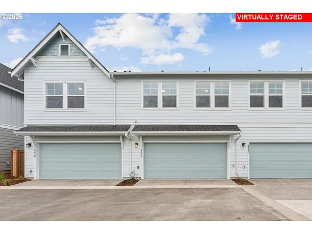 a front view of a house with a garage