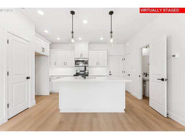 a view of kitchen with wooden floor