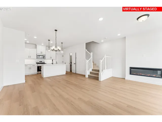 a view of kitchen with furniture and wooden floor