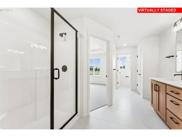 a bathroom with a shower and a sink