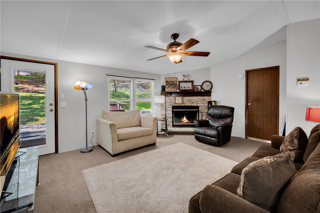 162 Newberry Road Walhalla, SC 29691 - Photo 5 of 50 Warm and inviting living space centered around a captivating fireplace, perfect for relaxation.