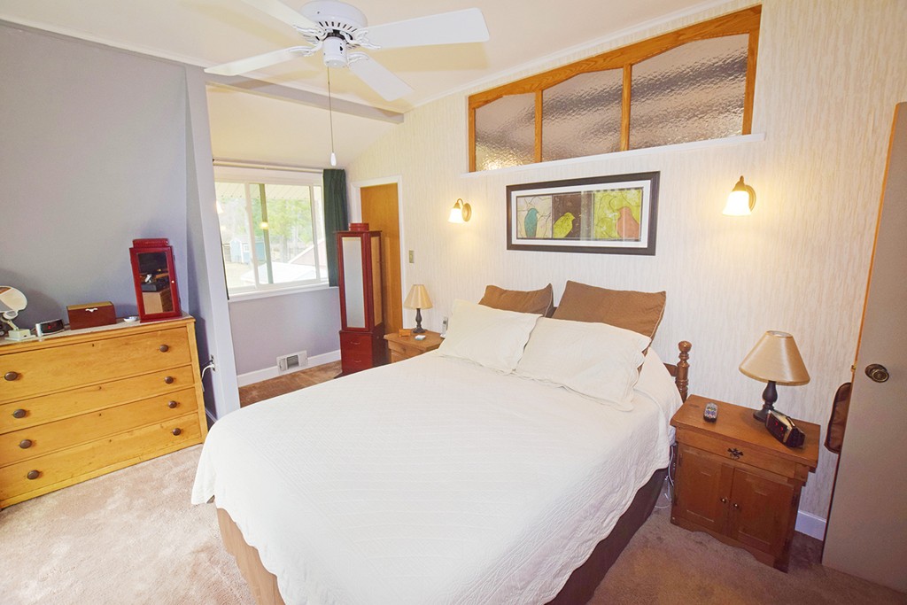205 Monson Turnpike Road Petersham, MA 01366 - Photo 14 of 30 a bedroom with a bed and wooden floor