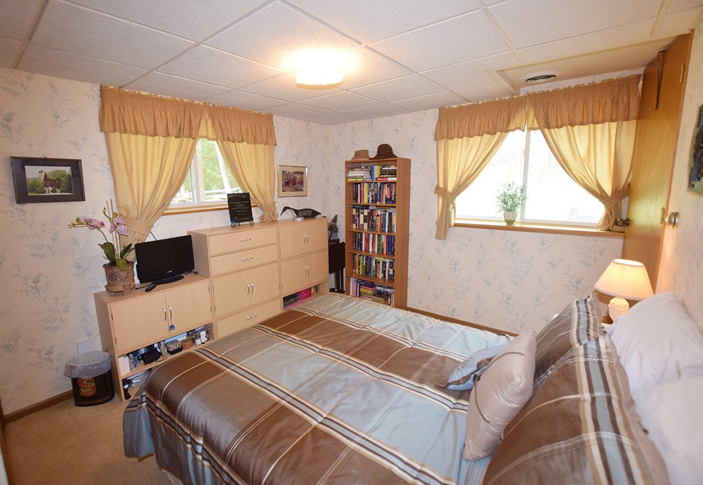 205 Monson Turnpike Road Petersham, MA 01366 - Photo 23 of 30 a bedroom with a bed and a window