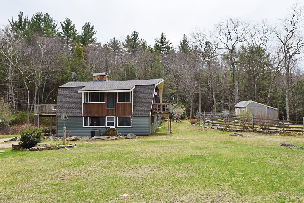 205 Monson Turnpike Road Petersham, MA 01366 - Photo 3 of 30 a backyard of a house with table and chairs