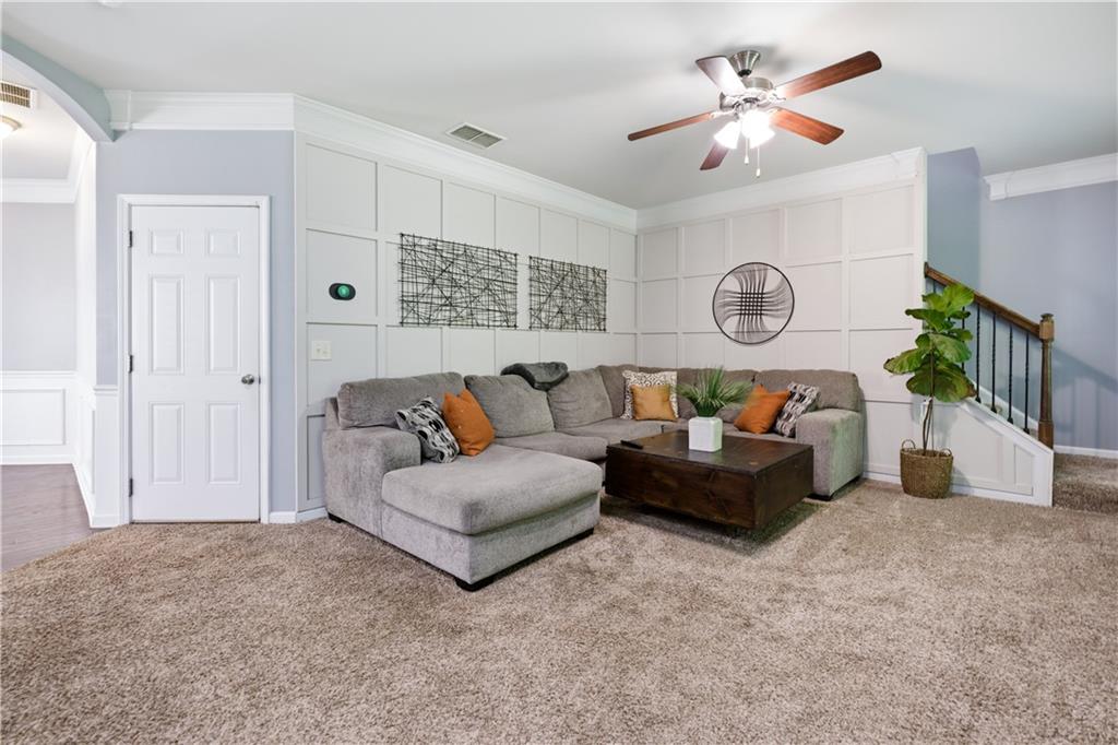 291 Boulder Run Hiram, GA 30141 - Photo 10 of 46 a living room with furniture a fireplace and a window