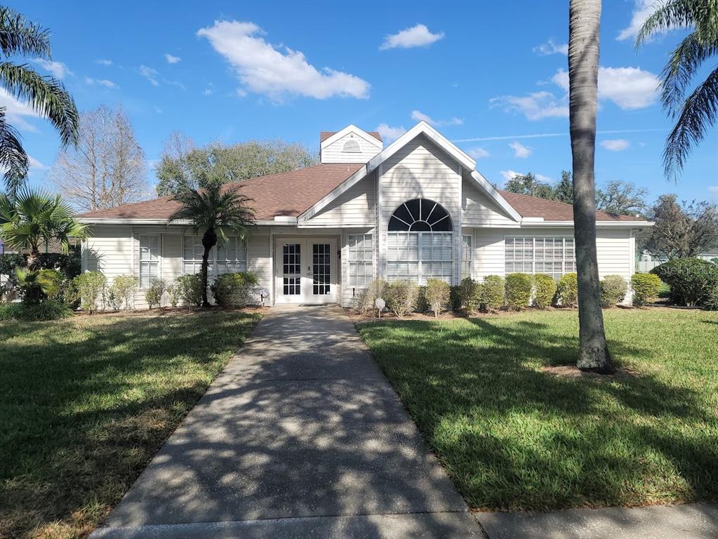21544 Clubside Loop Lutz, FL 33549 - Photo 10 of 11 a front view of a house with yard and green space