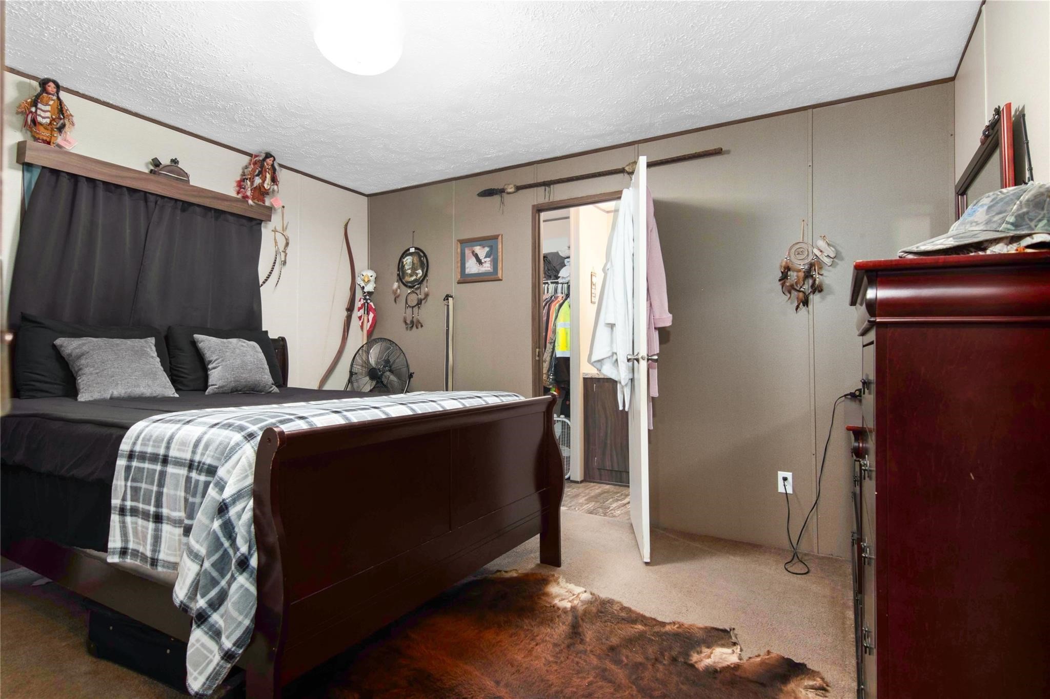 18093 Pickering Road Conroe, TX 77302 - Photo 19 of 29 a bedroom with a bed and a mirror