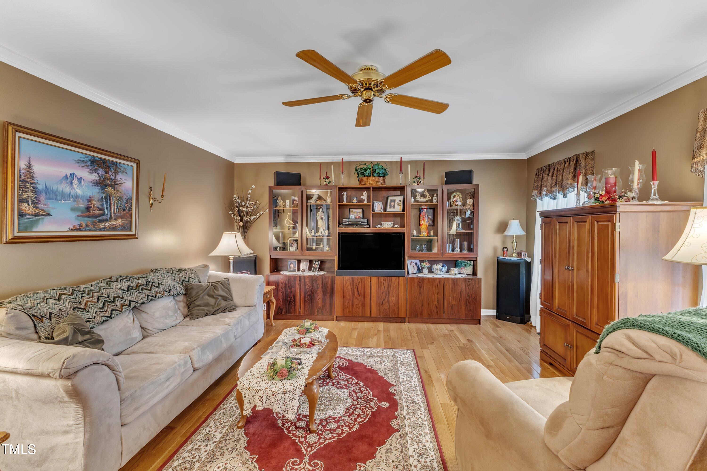 604 Young Forest Drive Wake Forest, NC 27587 - Photo 12 of 55 a living room with furniture and a rug