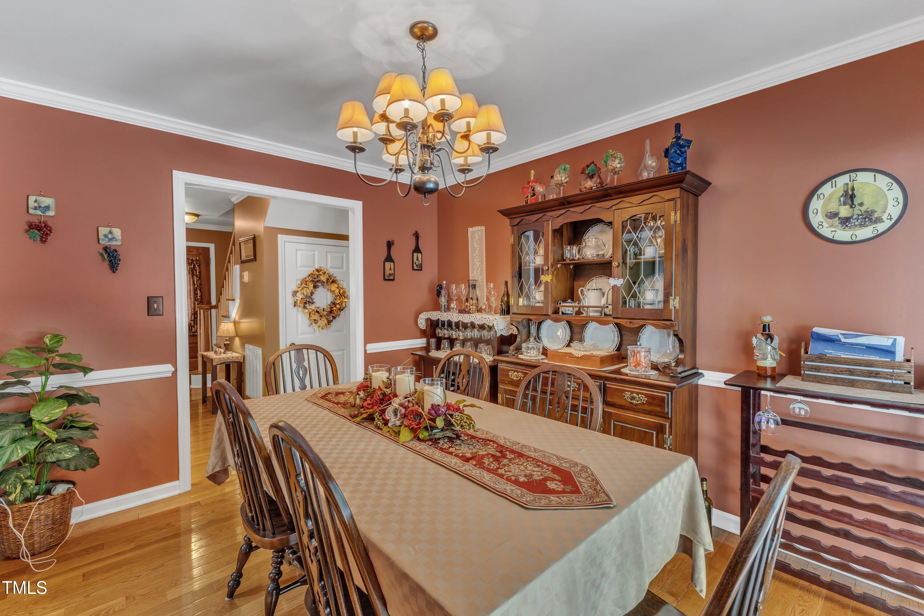604 Young Forest Drive Wake Forest, NC 27587 - Photo 16 of 55 a view of a dining room with furniture and chandelier