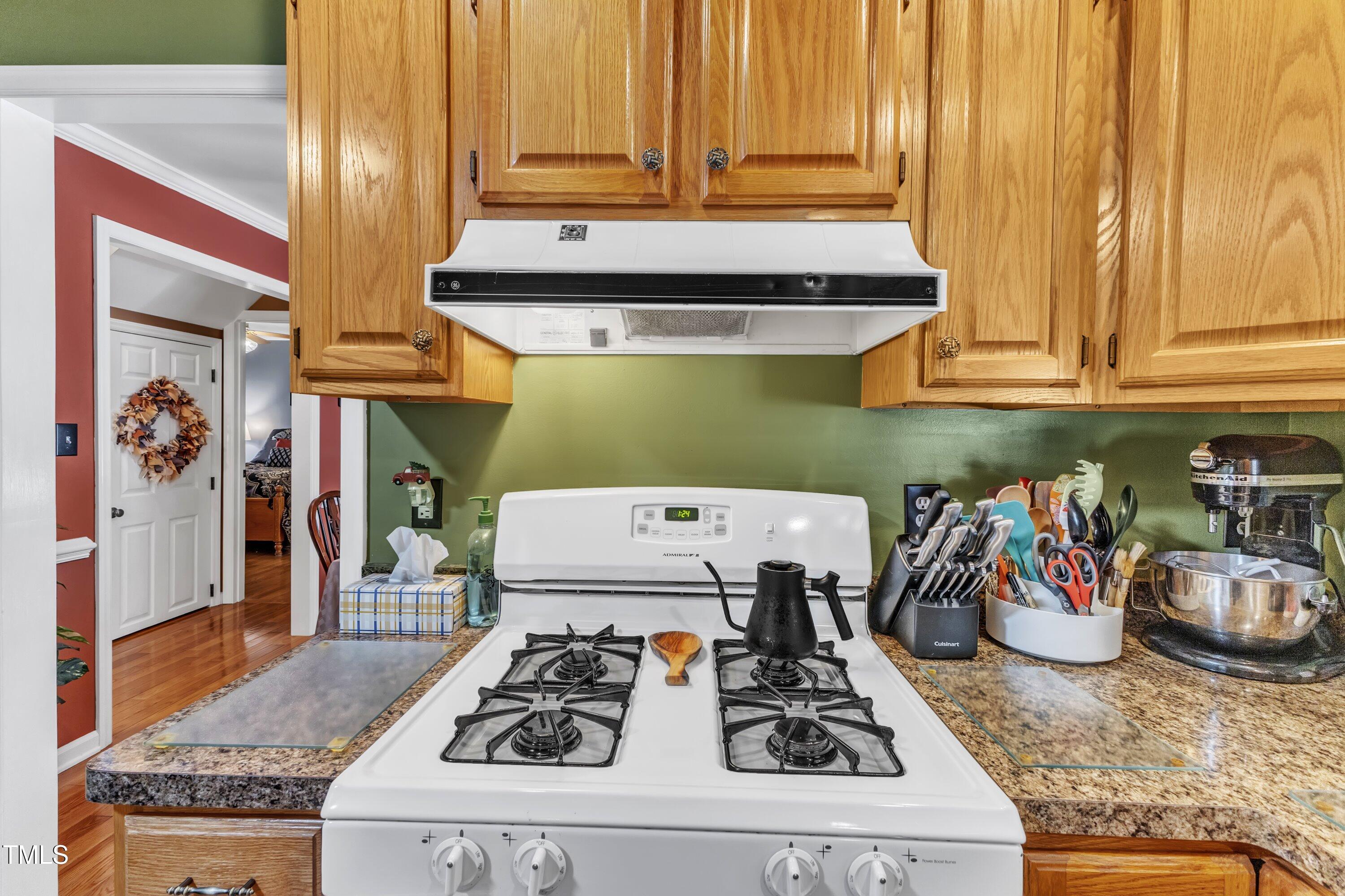 604 Young Forest Drive Wake Forest, NC 27587 - Photo 19 of 55 a kitchen with a stove and cabinets