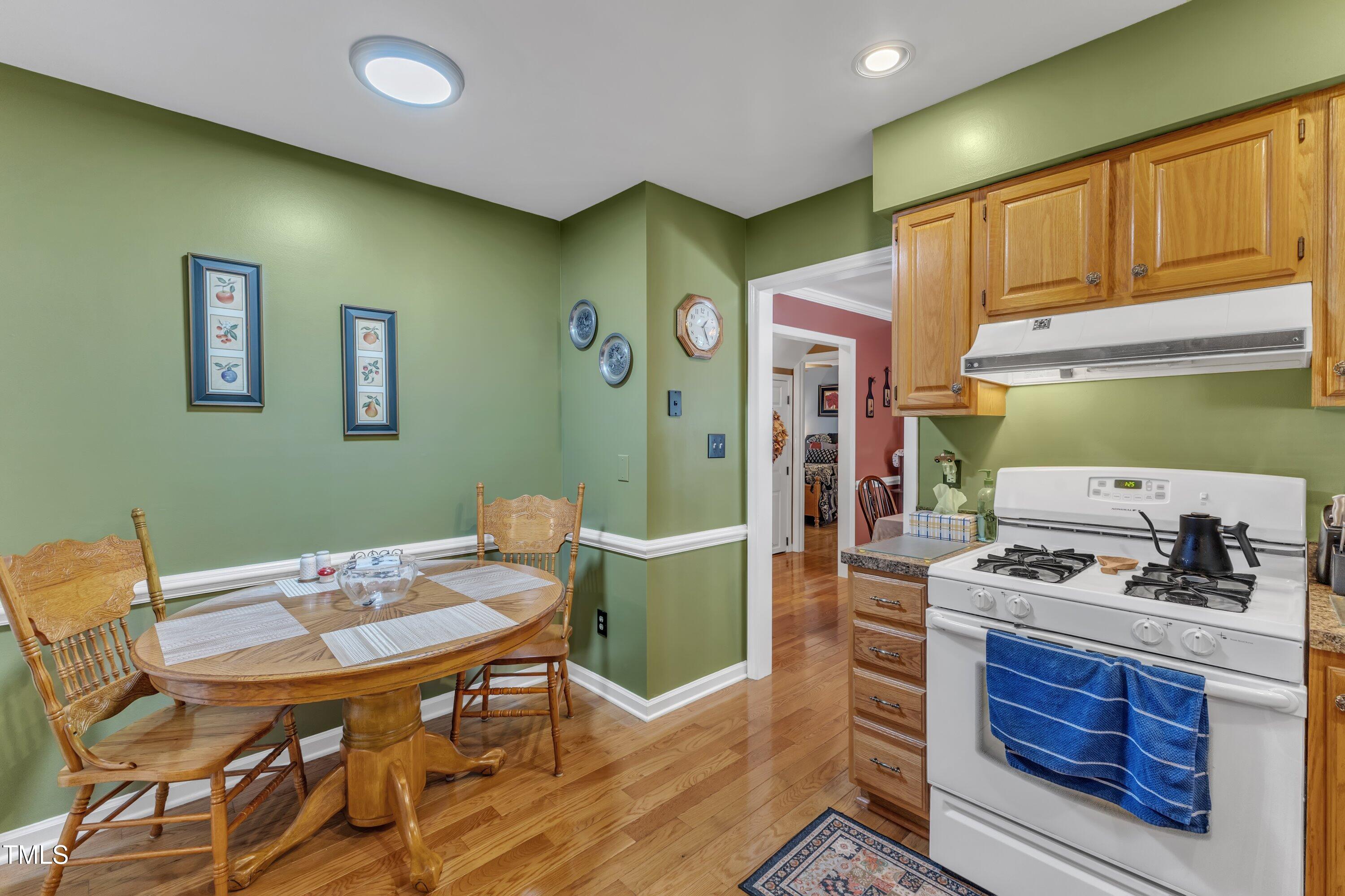 604 Young Forest Drive Wake Forest, NC 27587 - Photo 21 of 55 a kitchen with a table and chairs in it