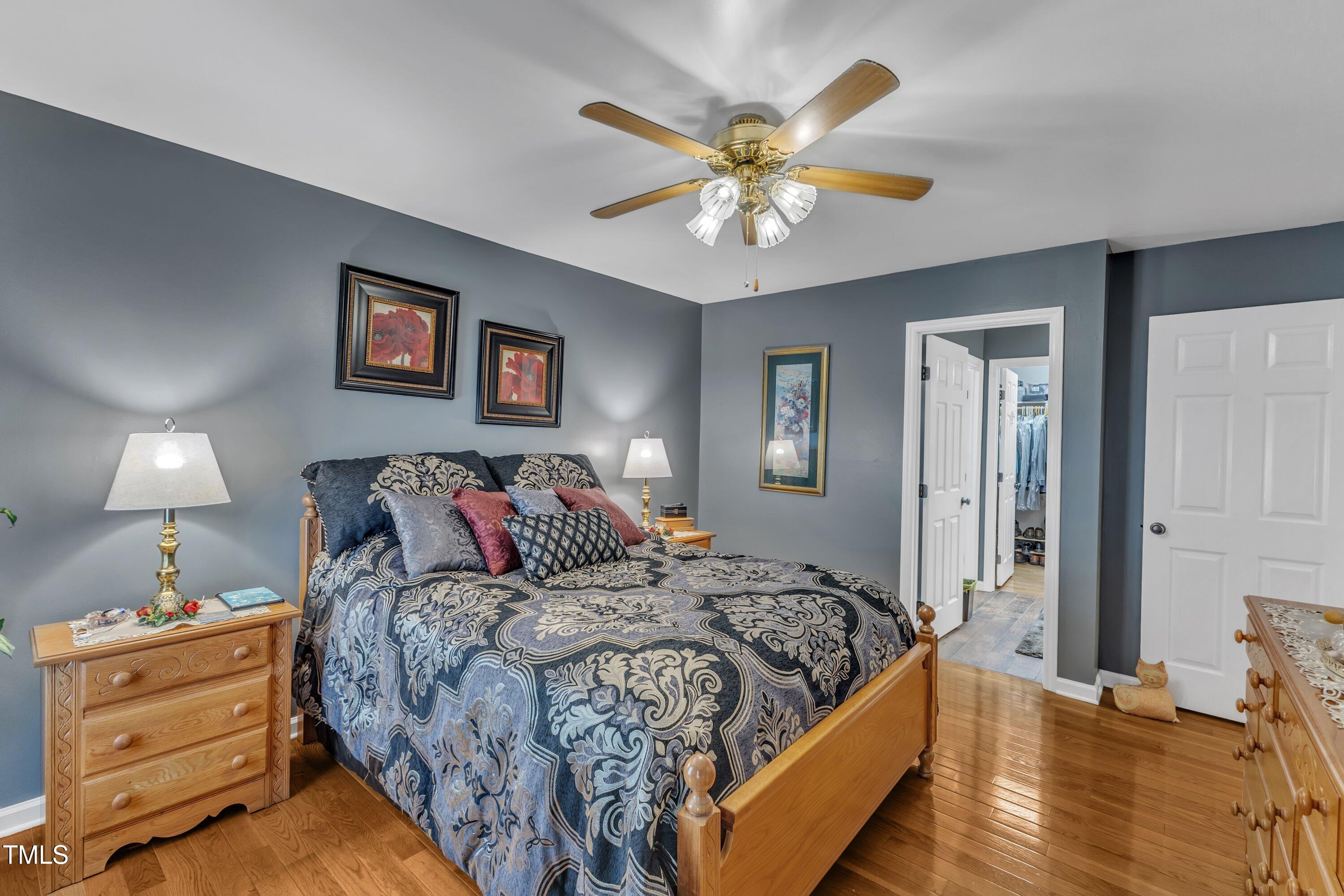 604 Young Forest Drive Wake Forest, NC 27587 - Photo 26 of 55 a bedroom with a bed and painting on the wall