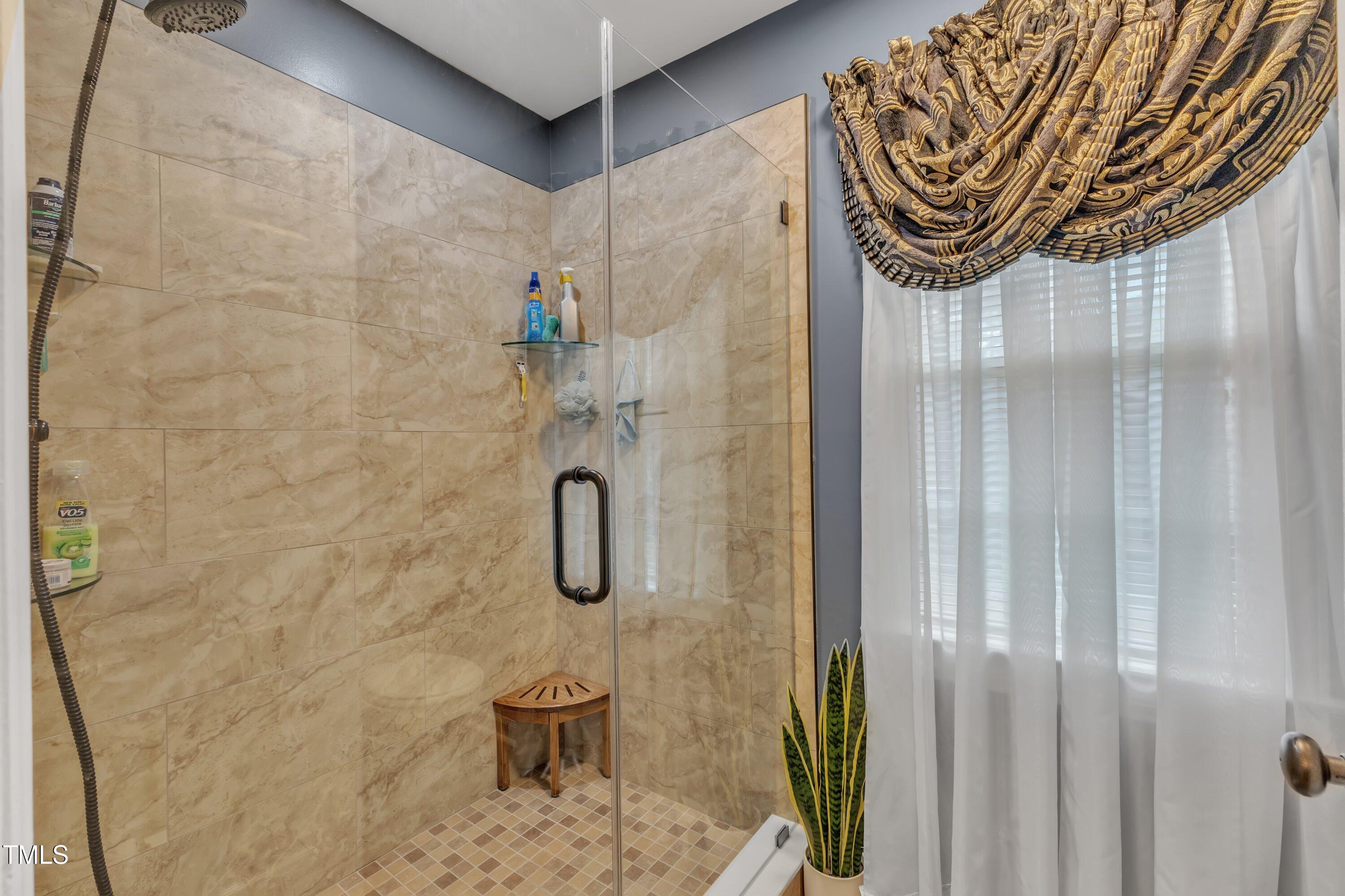 604 Young Forest Drive Wake Forest, NC 27587 - Photo 28 of 55 a bathroom with a shower and a shower