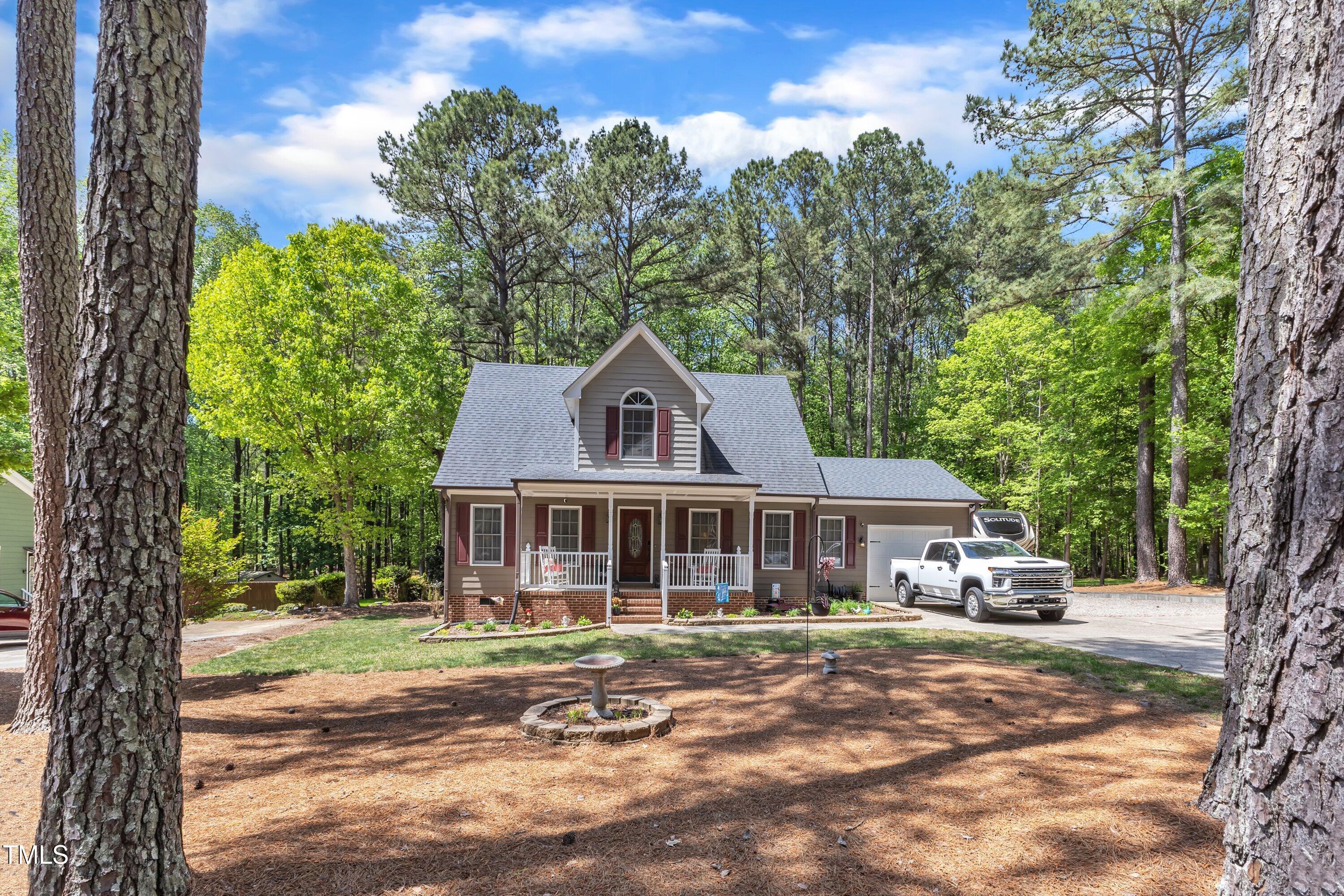 604 Young Forest Drive Wake Forest, NC 27587 - Photo 2 of 55 a front view of a house with a garden