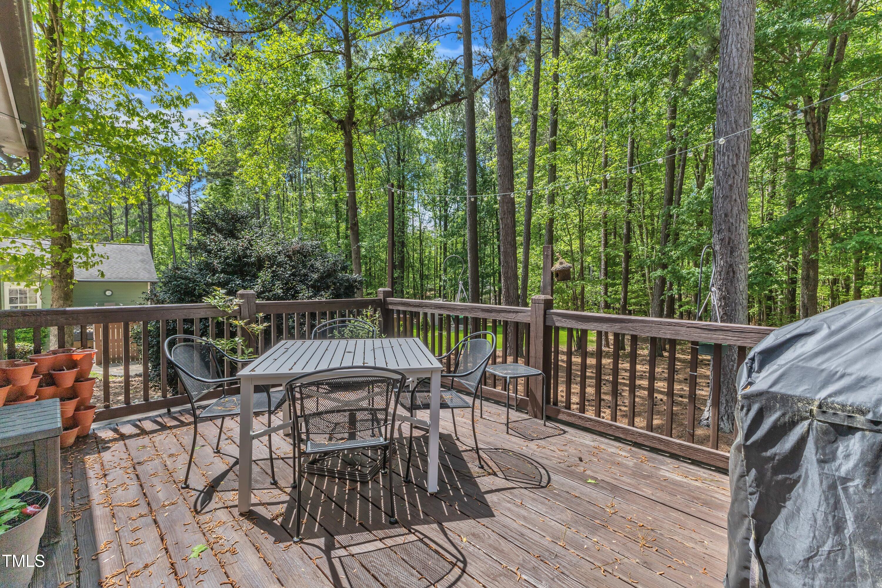 604 Young Forest Drive Wake Forest, NC 27587 - Photo 36 of 55 a view of a balcony with wooden floor and fence