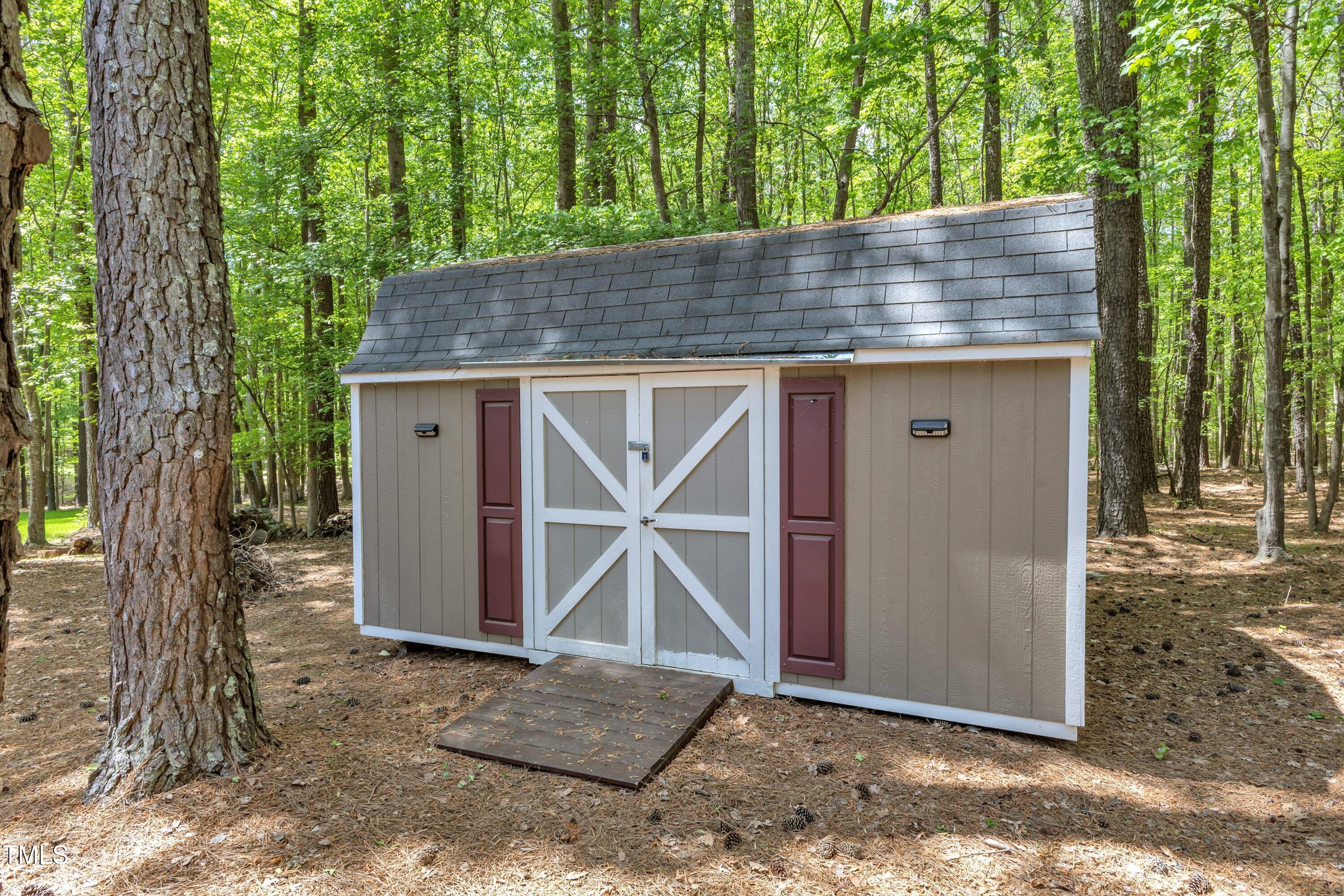 604 Young Forest Drive Wake Forest, NC 27587 - Photo 40 of 55 a wooden house with a outdoor space