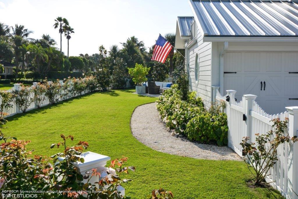 200 Colony Road Jupiter Inlet Colony, FL 33469 - Photo 3 of 26 a view of a backyard with plants and a patio