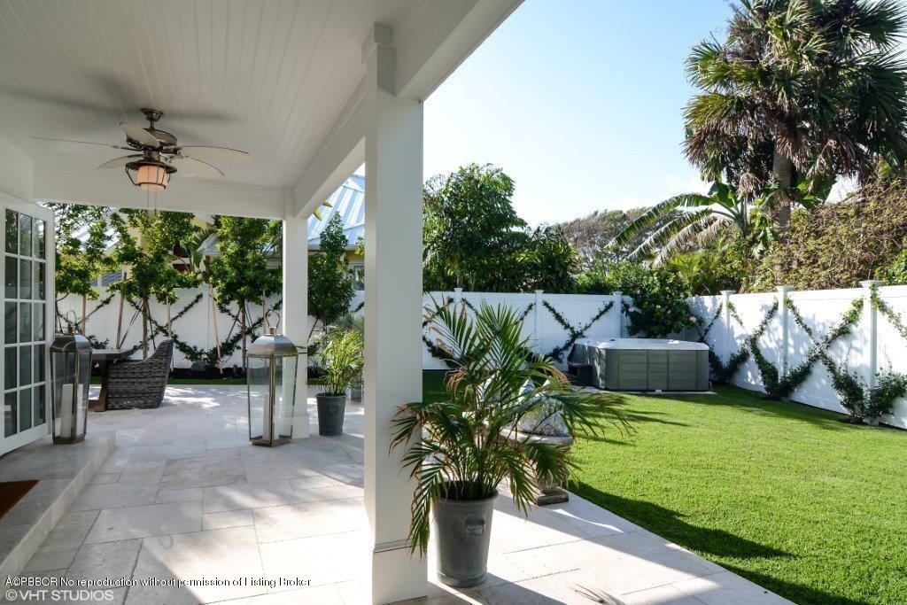 200 Colony Road Jupiter Inlet Colony, FL 33469 - Photo 22 of 26 a view of a porch with furniture and a yard