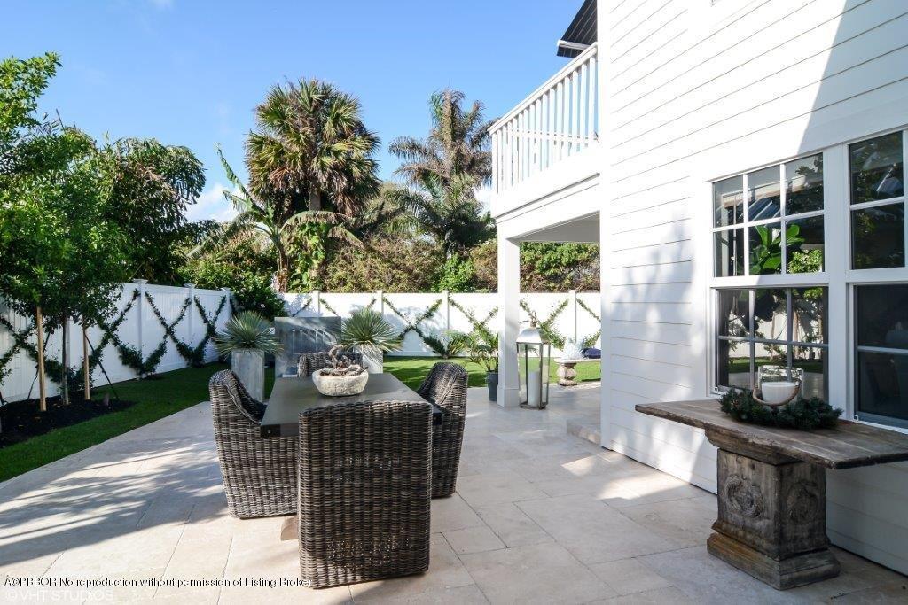 200 Colony Road Jupiter Inlet Colony, FL 33469 - Photo 4 of 26 a view of outdoor dining space with chairs and potted plants