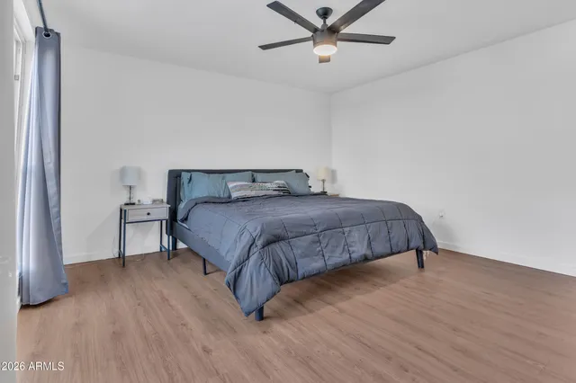 a bedroom with a bed and window