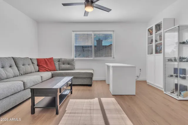 a living room with furniture and a rug